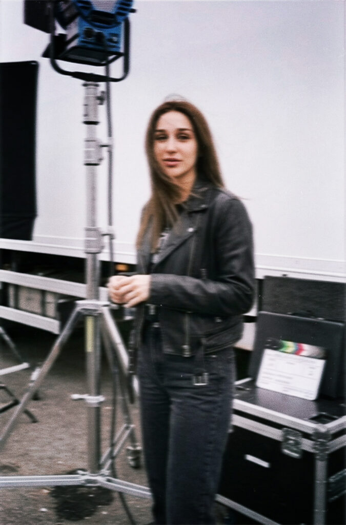 Aylin Baykal stands alongside production equipment on location for Baby Girl, a project she originally announced as her debut novel in 2024.
