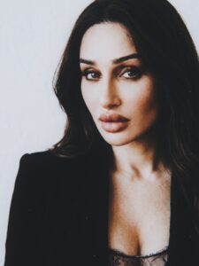 Close-up portrait of Aylin Baykal in a black blazer and lace bodysuit for Starchuska Women’s AW’26.
